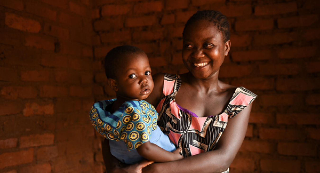 Young mother holding her toddler