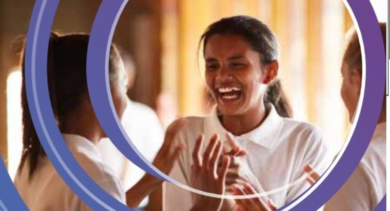 Adolescent girl clapping her hands and smiling